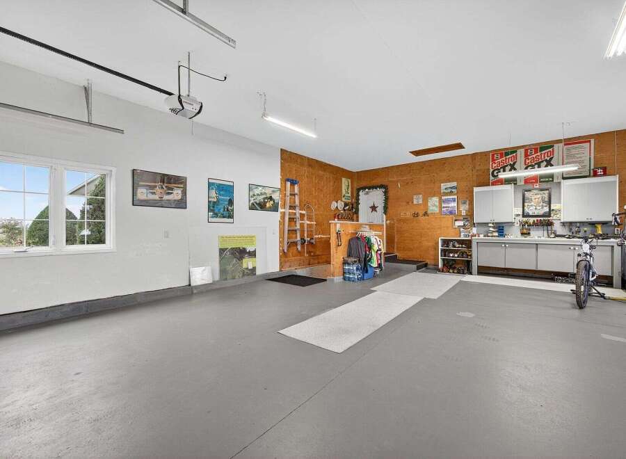 This spacious garage offers ample room for vehicles, hobbies, or storage.