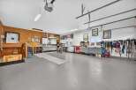 This spacious garage offers ample room for vehicles, storage, and hobbies.