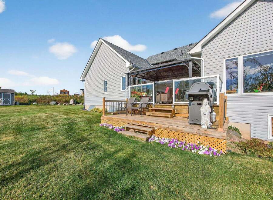 Enjoy outdoor living at its finest with this stunning property featuring a spacious deck, perfect for entertaining or relaxing.