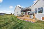 Enjoy outdoor living at its finest with this stunning property featuring a spacious deck, perfect for entertaining or relaxing.