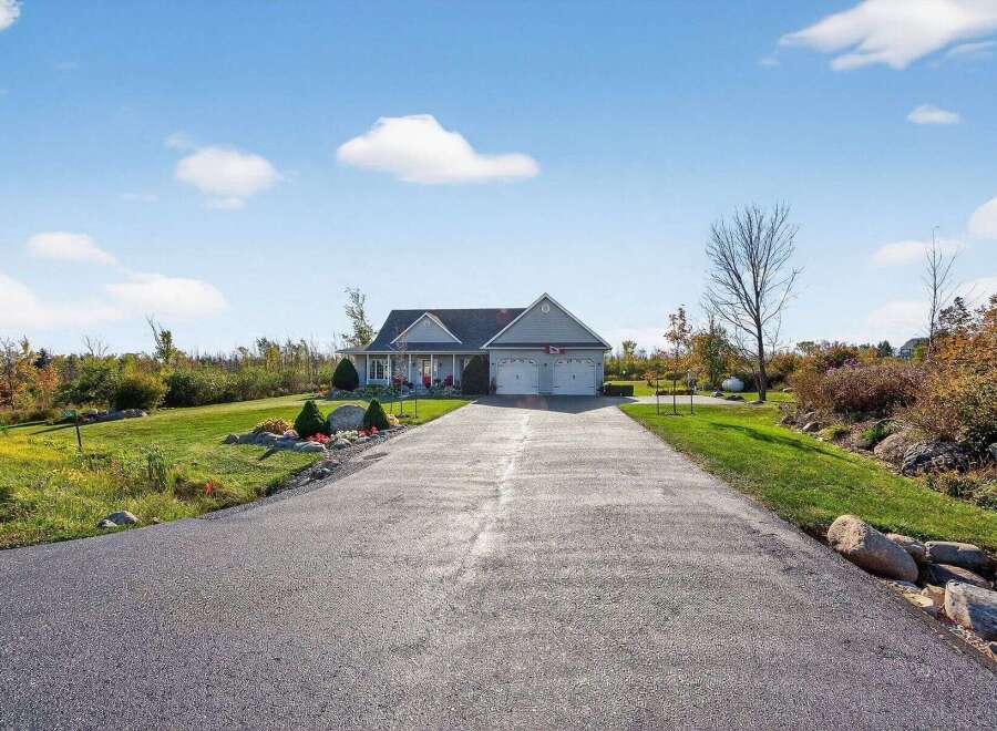 This stunning property boasts a beautifully designed home with a spacious driveway, perfect for those who value both style and convenience.