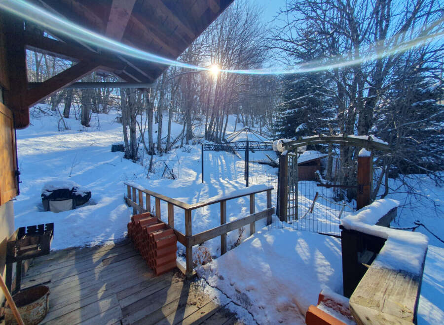 This charming property offers a serene winter landscape, perfect for those seeking a peaceful retreat.