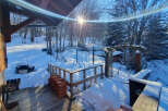 This charming property offers a serene winter landscape, perfect for those seeking a peaceful retreat.