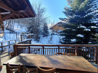 Enjoy breathtaking mountain views from this charming chalet.