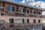 Discover the charm of this stunning chalet nestled in a picturesque mountain setting.