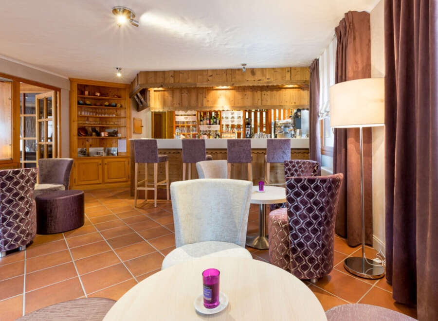 Step into a cozy and inviting bar area, perfect for relaxing and socializing.