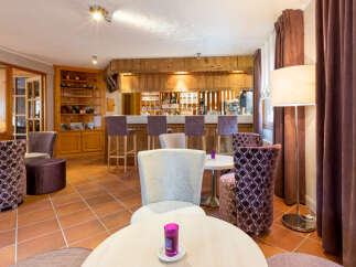 Step into a cozy and inviting bar area, perfect for relaxing and socializing.