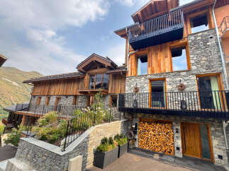 Discover the charm of this stunning mountain chalet, boasting a unique blend of stone and wood architecture.