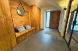 Step into luxury with this stunning entryway featuring exquisite wood paneling and a cozy bench.