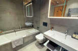 Step into luxury with this stunning bathroom featuring modern design and high-end finishes.