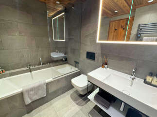 Step into luxury with this stunning bathroom featuring modern design and high-end finishes.