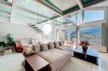 Experience luxury living in this stunning property featuring a unique glass ceiling and a modern staircase.