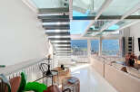 Experience luxury living in this stunning property featuring a modern glass ceiling and sleek staircase.