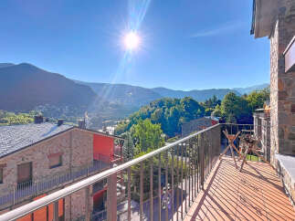 Enjoy breathtaking mountain views from this charming property.