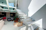 This stunning property boasts a modern design with a unique floating staircase and an abundance of natural light.