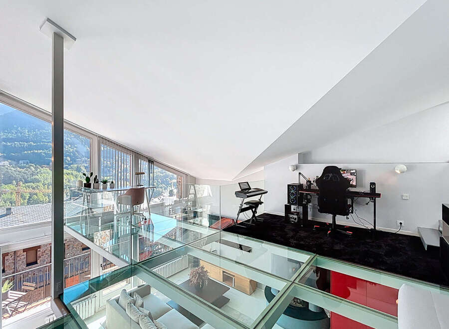 Experience luxury living in this stunning modern loft with a unique glass floor design.