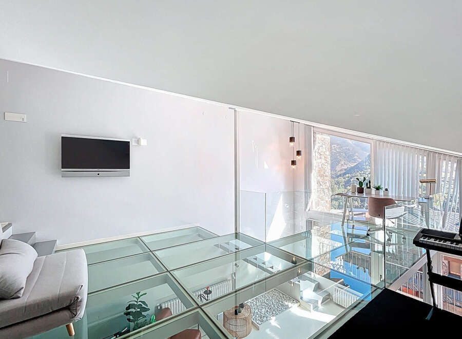 Experience modern luxury in this stunning property featuring a unique glass floor design.
