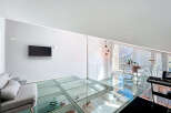Experience modern luxury in this stunning property featuring a unique glass floor design.