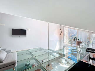 Experience modern luxury in this stunning property featuring a unique glass floor design.