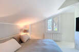 This stunning bedroom boasts a bright and airy atmosphere, perfect for relaxation.