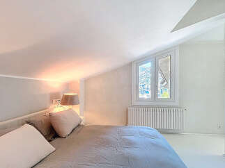 This stunning bedroom boasts a bright and airy atmosphere, perfect for relaxation.