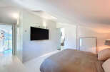 Experience modern elegance in this stunning bedroom.