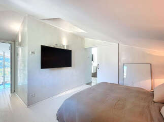Experience modern elegance in this stunning bedroom.