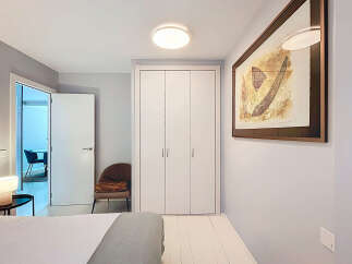Discover the charm of this beautifully designed bedroom, featuring a modern aesthetic and ample natural light.