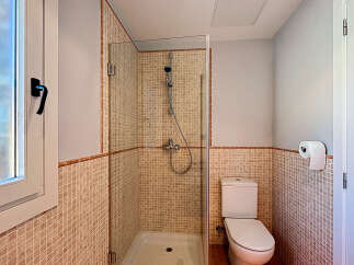 Step into this inviting bathroom featuring a modern shower enclosure and stylish tile work.