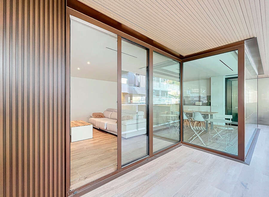 Experience modern living with this stunning property featuring expansive glass walls that seamlessly blend indoor and outdoor spaces.