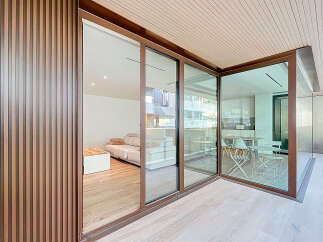 Experience modern living with this stunning property featuring expansive glass walls that seamlessly blend indoor and outdoor spaces.