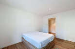 This modern bedroom offers a serene retreat with its minimalist design and neutral color palette.