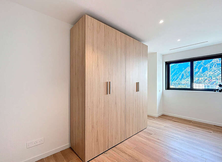 Discover this stunning property featuring a modern wardrobe with ample storage space.
