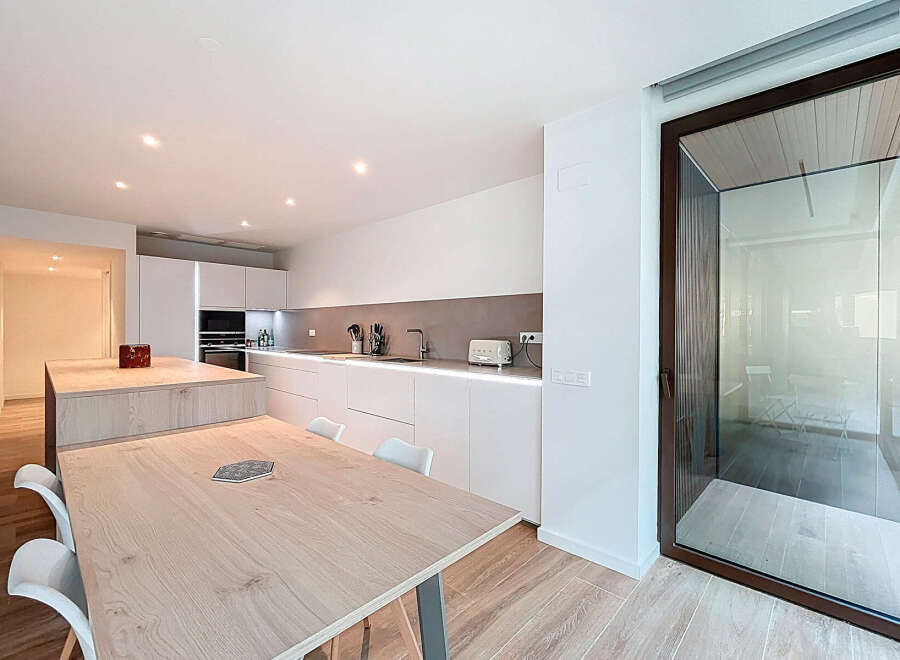 Experience modern living in this stunning kitchen! Featuring sleek white cabinetry, a spacious island, and a stylish dining area, this space is perfect for both cooking and entertaining.