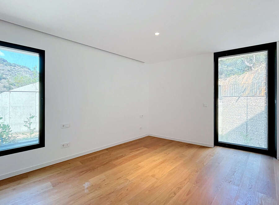 Experience modern living in this bright and airy room featuring a sleek design and abundant natural light.