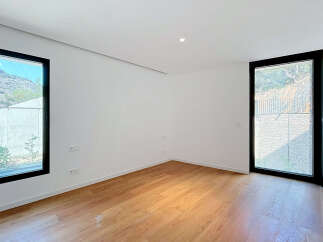 Experience modern living in this bright and airy room featuring a sleek design and abundant natural light.