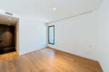 Experience modern living in this unfurnished room featuring a sleek design and ample natural light.