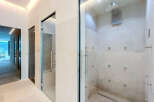Experience ultimate relaxation in this luxurious spa-like bathroom featuring a spacious multi-jet shower enclosure.