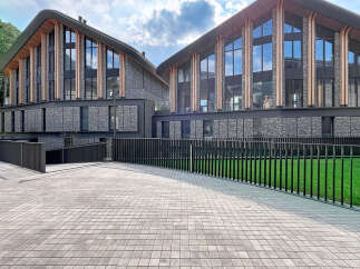 Discover modern architectural brilliance with this stunning property, featuring a unique gabion stone facade and expansive glass windows that invite natural light.