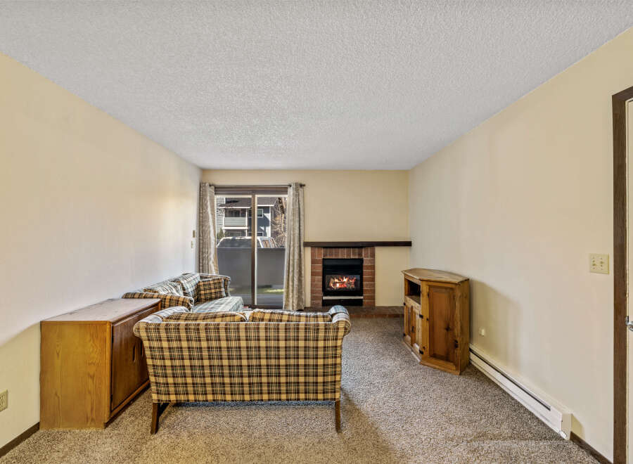 Cozy living room featuring a fireplace, perfect for relaxing evenings.