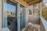 Enjoy the fresh air and stunning views from this charming balcony! This property features a cozy seating area, perfect for relaxing or entertaining.