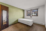 This cozy bedroom features a comfortable bed, perfect for a relaxing night's sleep.