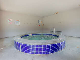 Enjoy a relaxing soak in this inviting spa, perfect for unwinding after a long day.