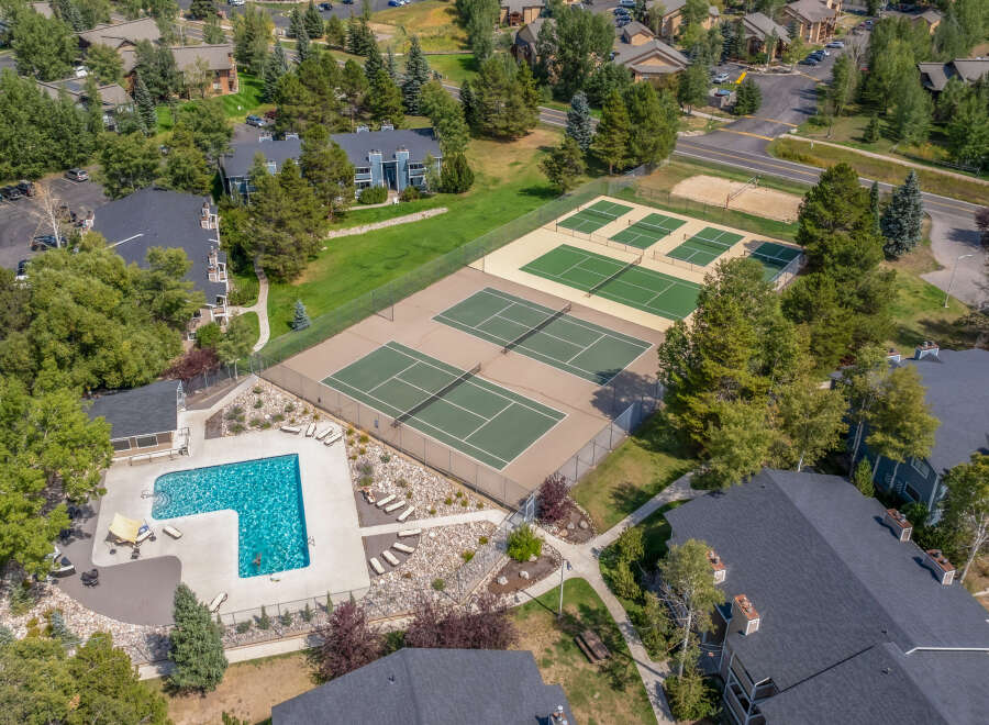 Discover the epitome of luxury living with this stunning property, boasting a refreshing pool and multiple tennis courts for your enjoyment.