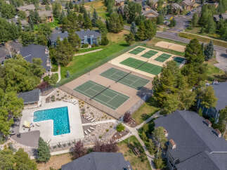 Discover the epitome of luxury living with this stunning property, boasting a refreshing pool and multiple tennis courts for your enjoyment.