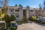 Discover this charming condo complex featuring a neutral exterior and well-maintained landscaping.