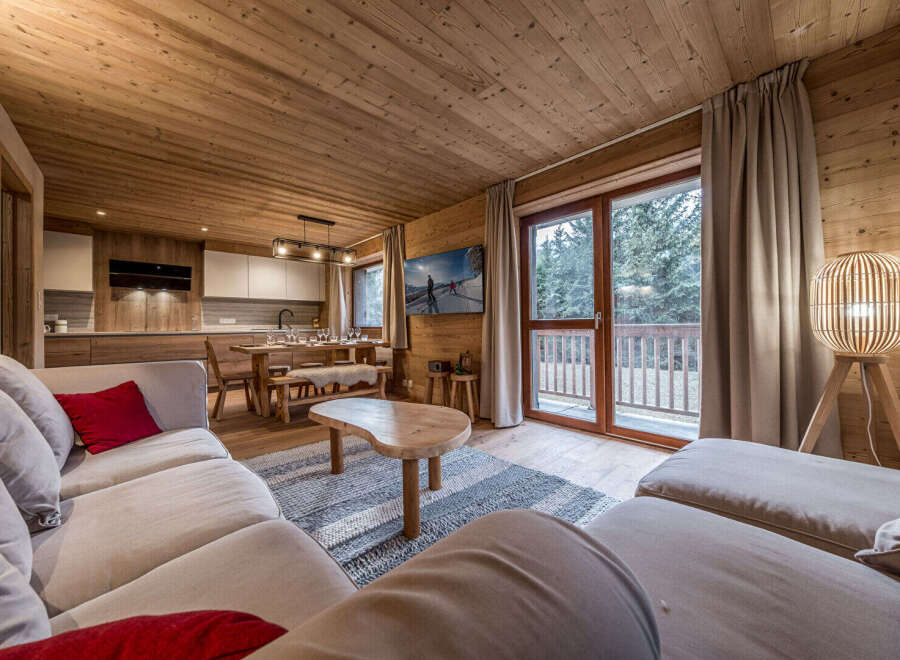 Experience the warmth and charm of this stunning property, featuring a beautifully designed living space with wooden accents throughout.