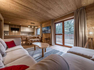 Experience the warmth and charm of this stunning property, featuring a beautifully designed living space with wooden accents throughout.