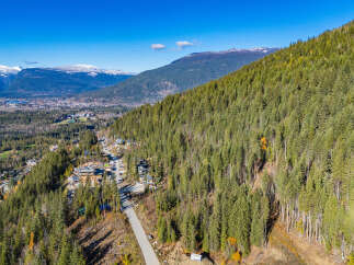 Discover the tranquility of mountain living with this stunning property nestled amidst lush greenery.