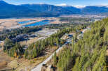 This stunning property offers breathtaking views of the surrounding mountains and valleys.